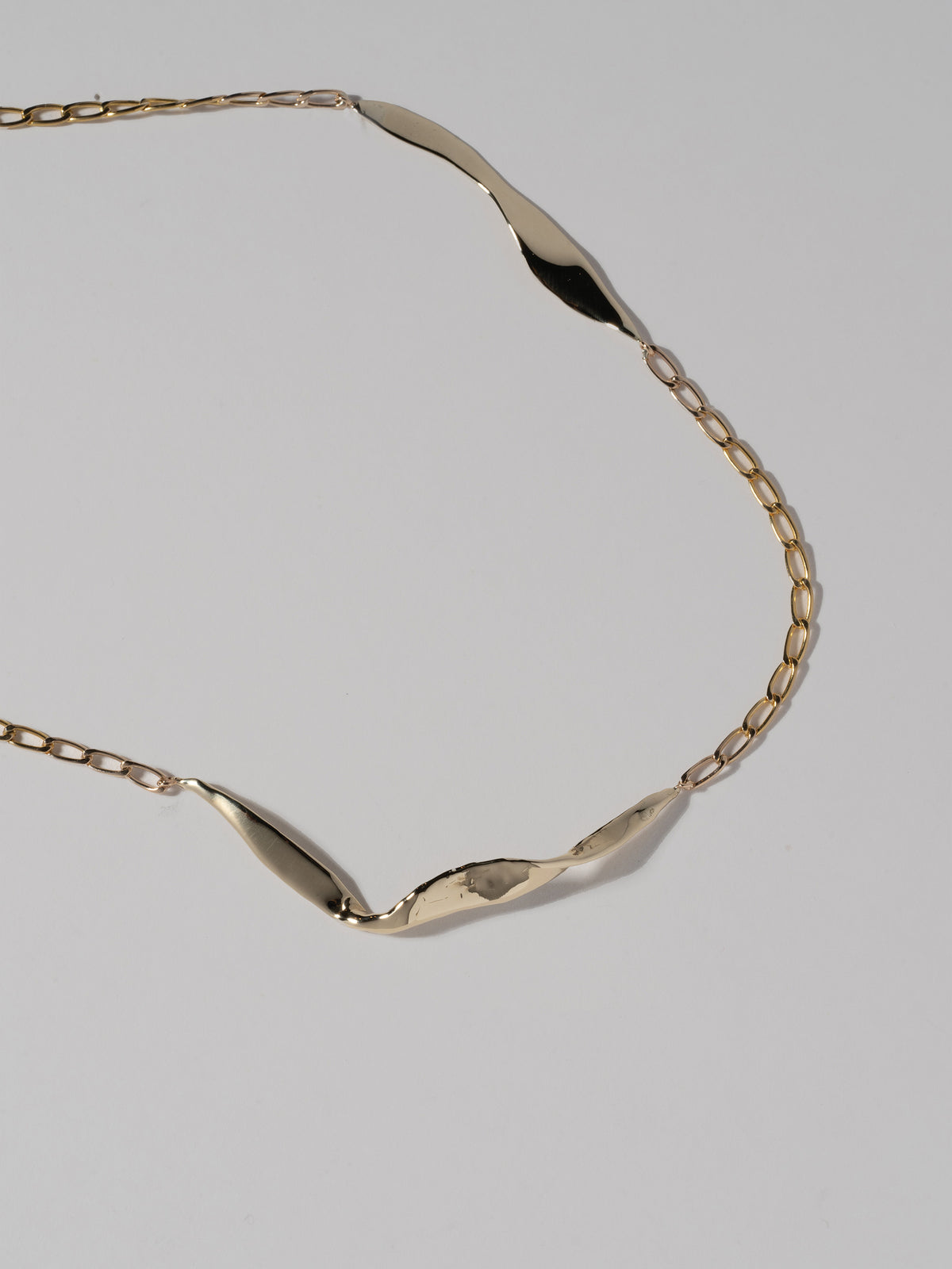 Close up image of FARIS BLADE Necklace in 14k gold-plated bronze