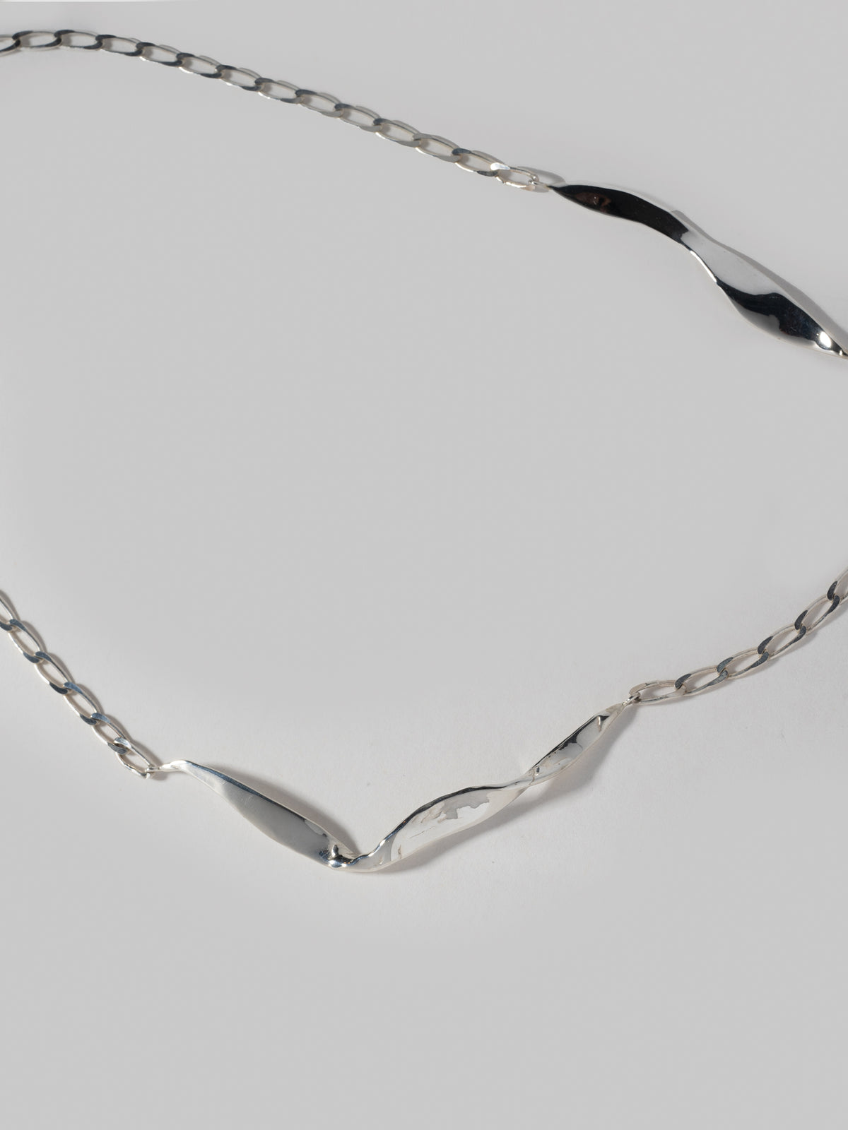 Close up image of FARIS BLADE Necklace in sterling silver