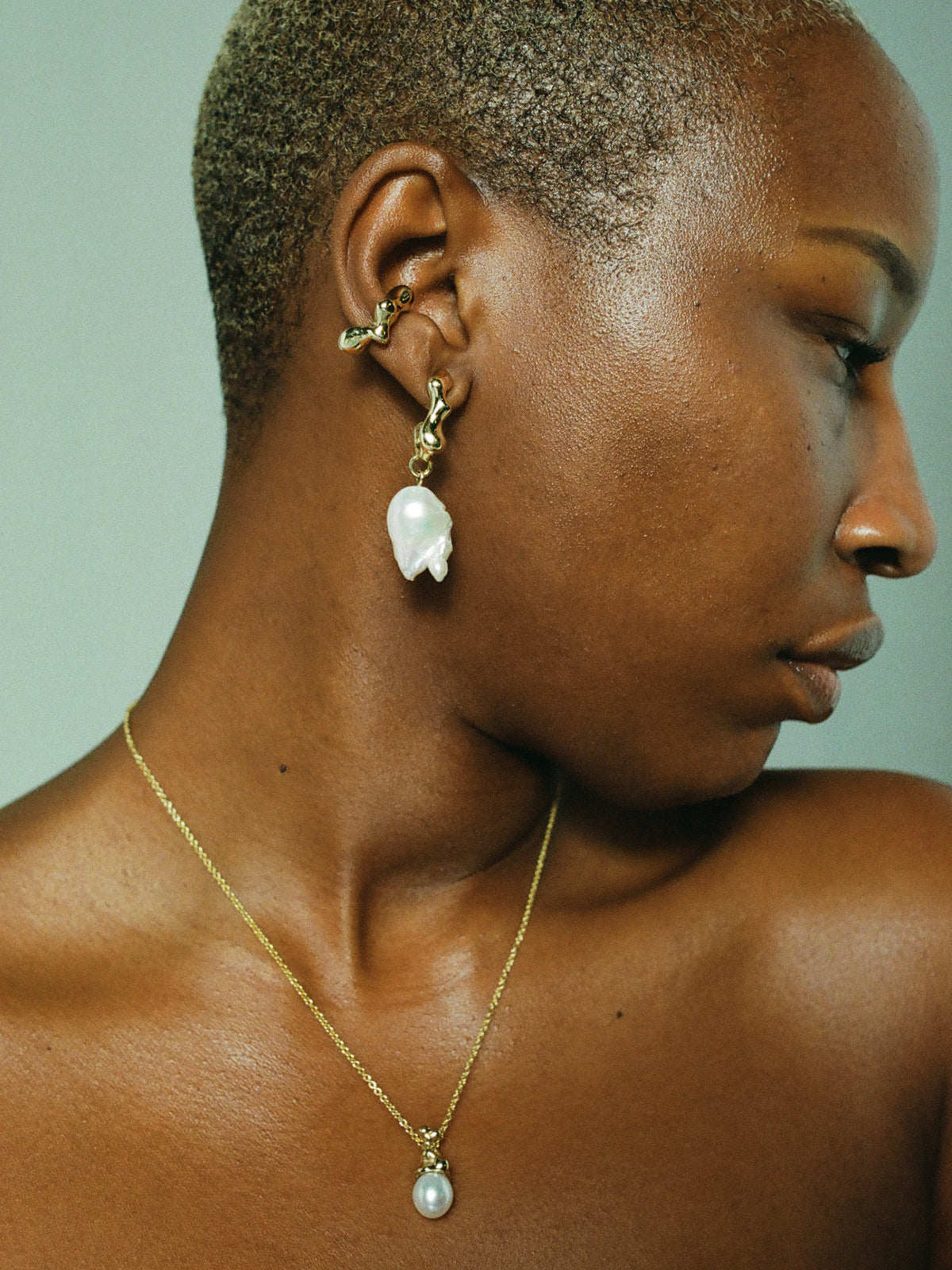 FARIS SEEP BAROQUE Drops in 14k Gold Plate styled on female model, styled with SEEP Ear Cuff in 14k Gold Plate, and SOPHIA Necklace in 14k Gold Plate