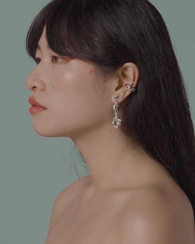 Moving image of model wearing FARIS FELLINI Drops in sterling silver with grey pearl, styled with GROSSO GEM Ear Cuff in sterling silver with citrine