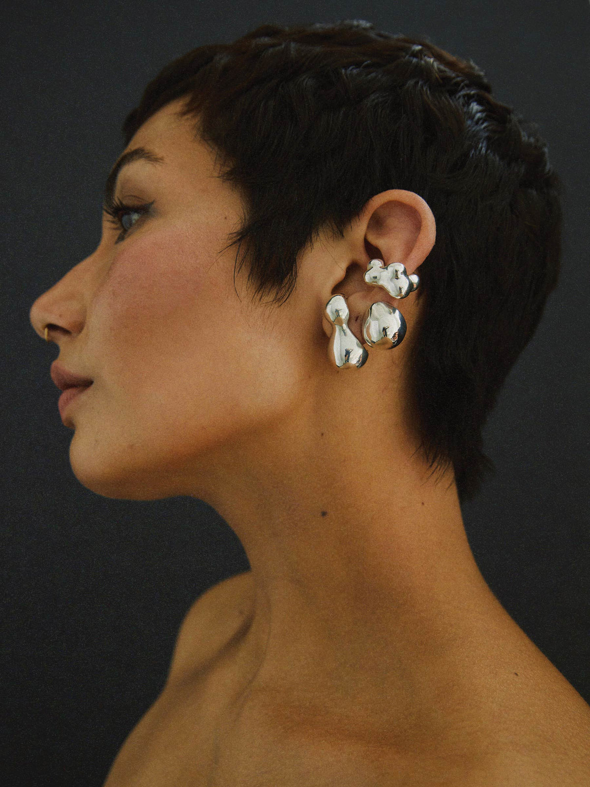 FARIS KUMO Ear Cuff in sterling silver worn on model, styled with SUMO Stud and BOLO Stud, both in sterling silver