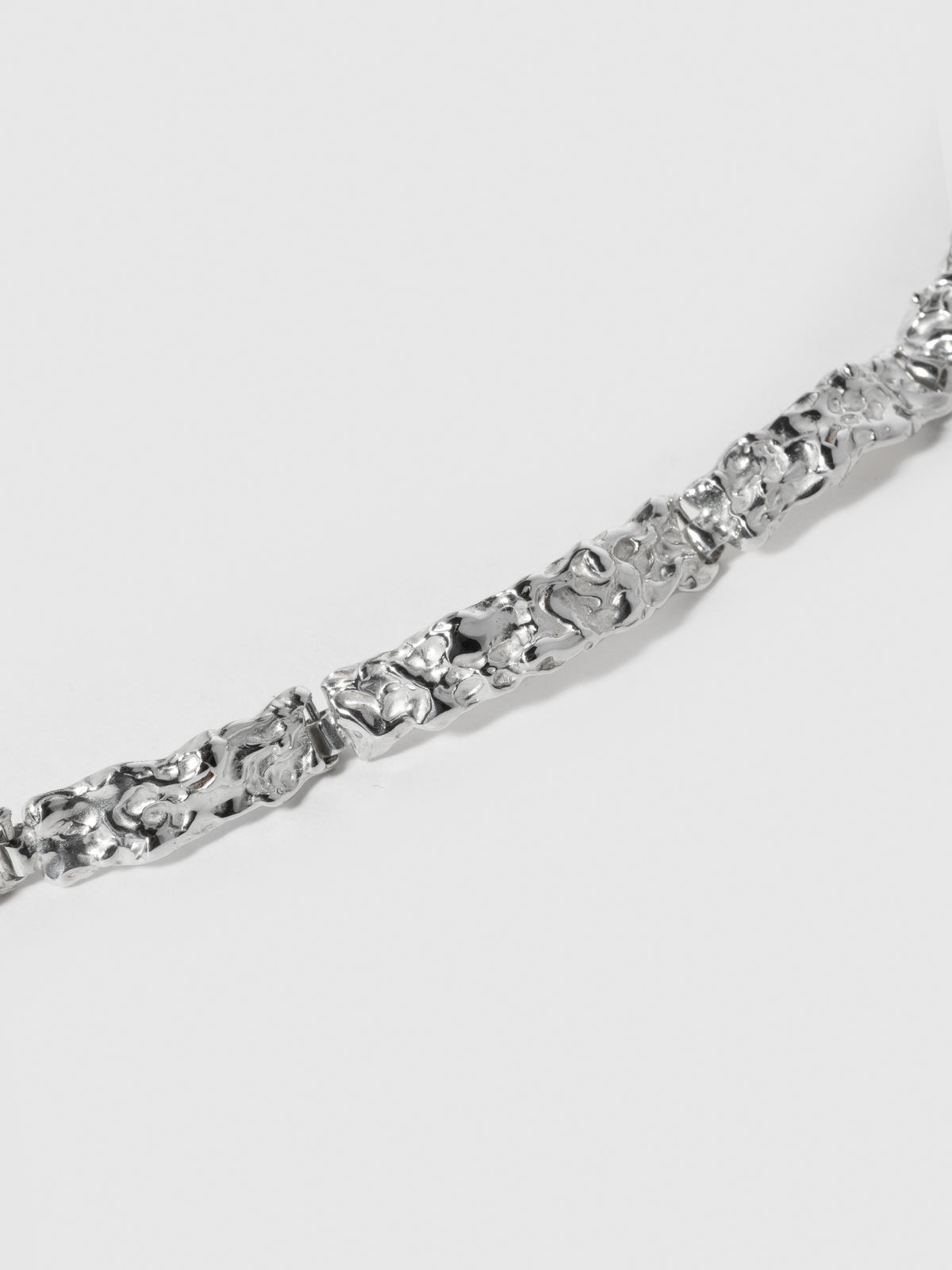 Close up product image of FARIS BRUTO Bracelet links in sterling silver (emphasis on ROCA texture)