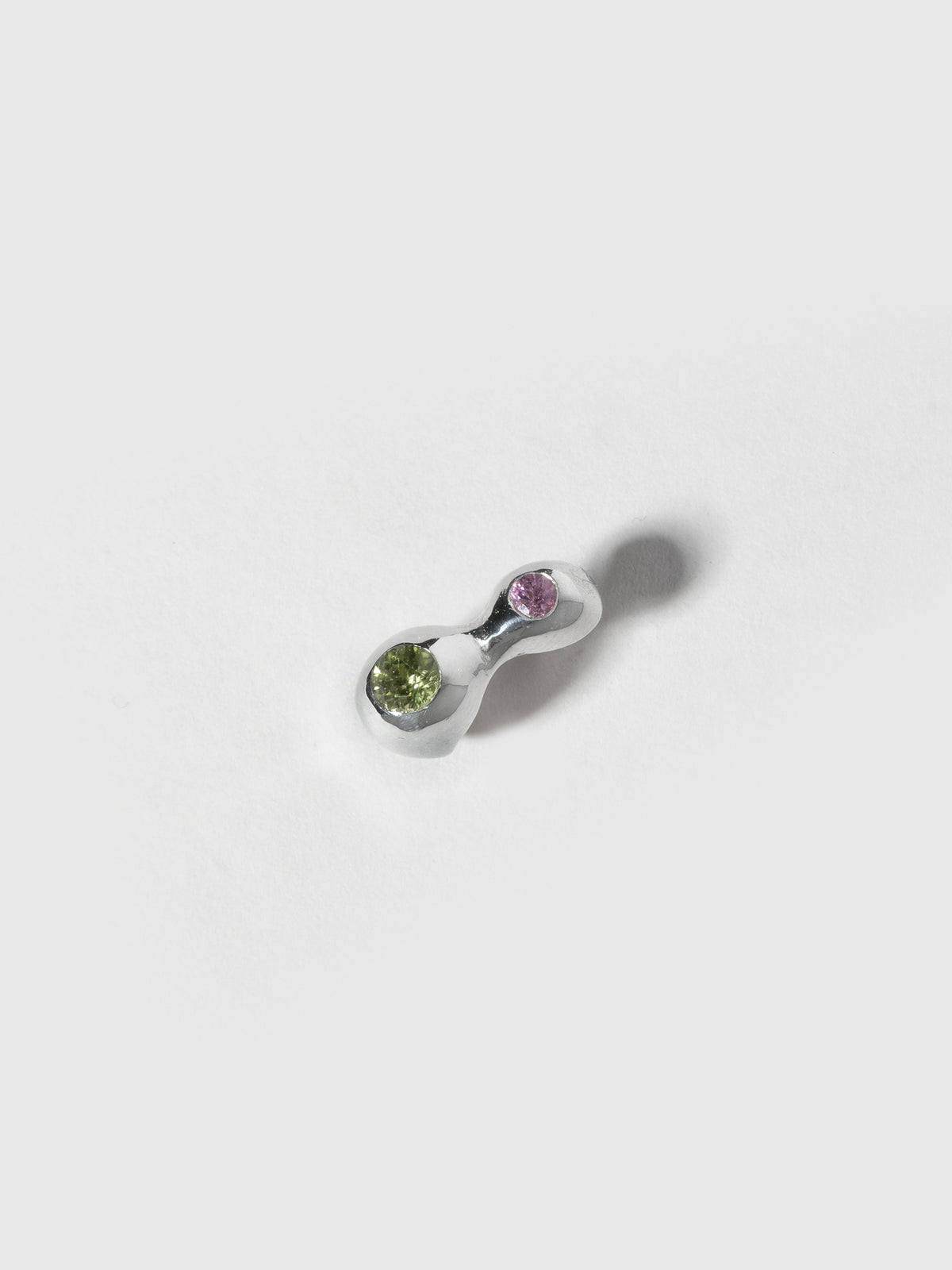 Product image of FARIS CHAMELLE GEM Stud in sterling silver with 3mm pink sapphire and 4mm peridot (angled front view)