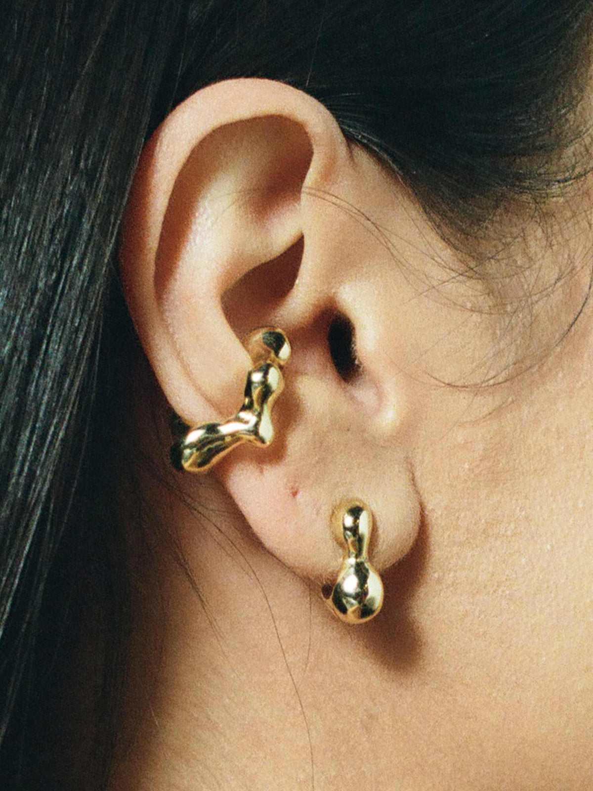 FARIS SEEP Ear Cuff in 14k gold plated bronze, shown on model. Styled with CHAMELLE Stud in 14k gold.