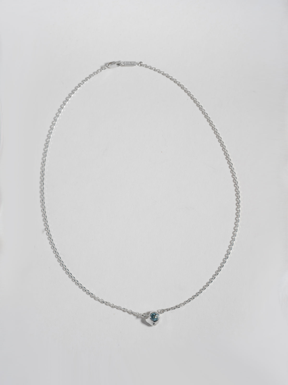 Product image of FARIS KIRA Necklace in sterling silver with topaz, full product shown on white background, front view
