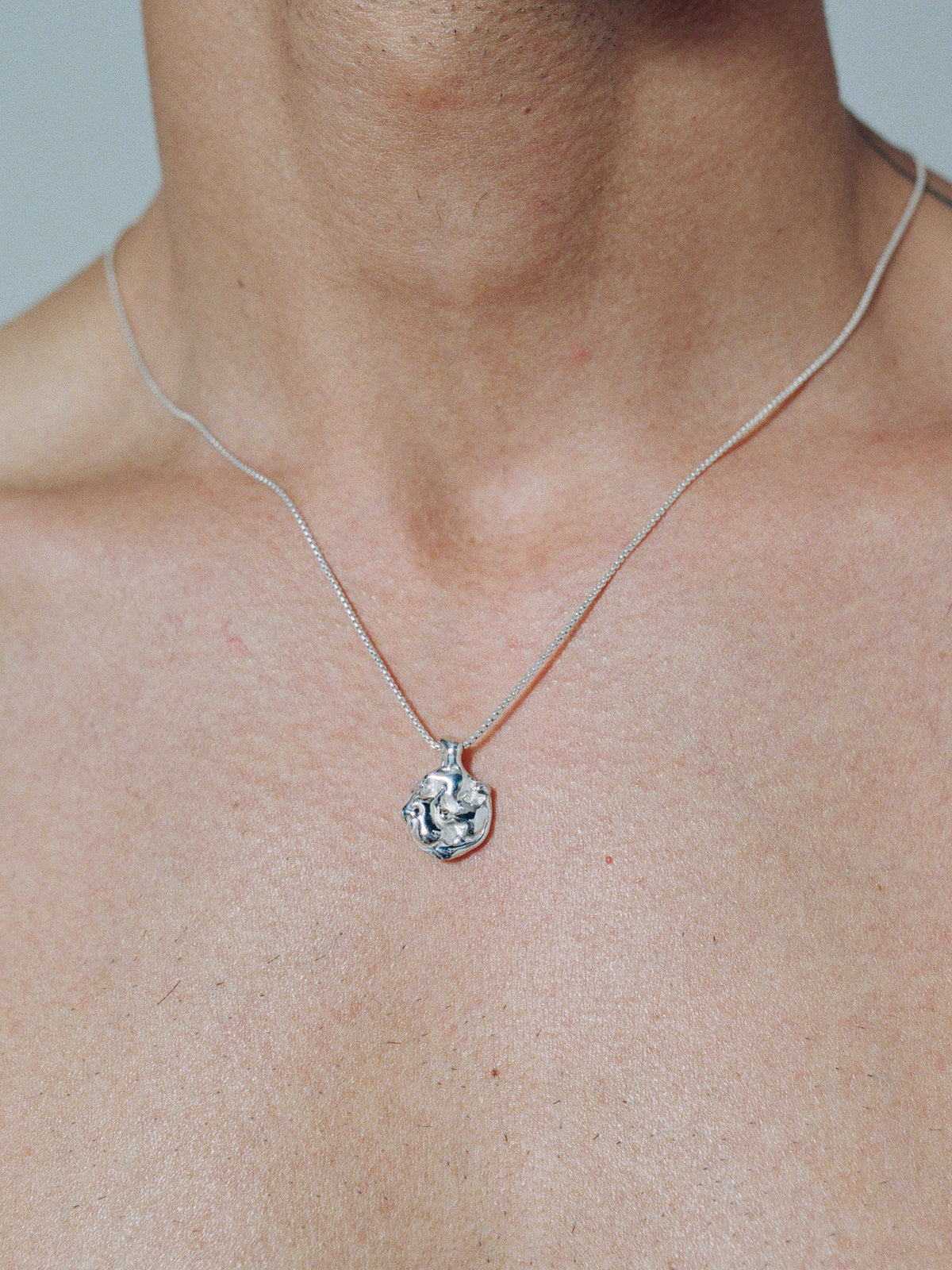 LAVA DIME Pendant in sterling silver on model