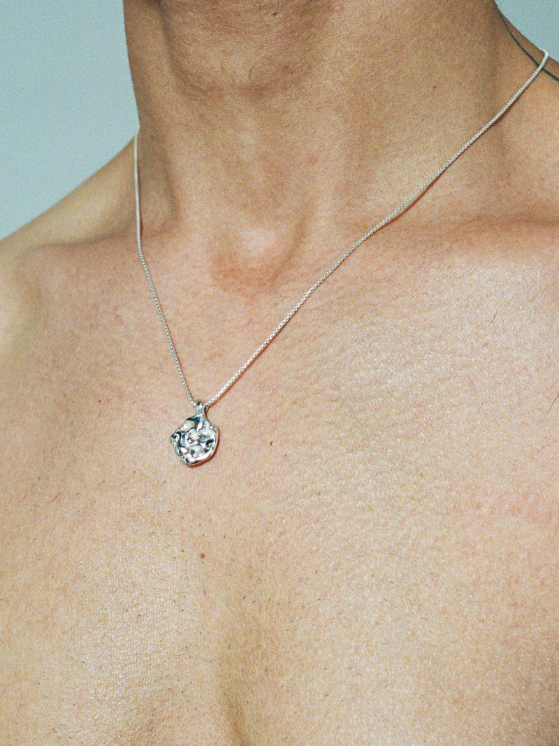 LAVA DIME Pendant in sterling silver on model