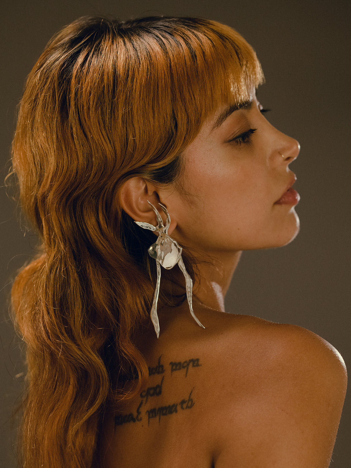 MONSTRA earring in sterling silver on model