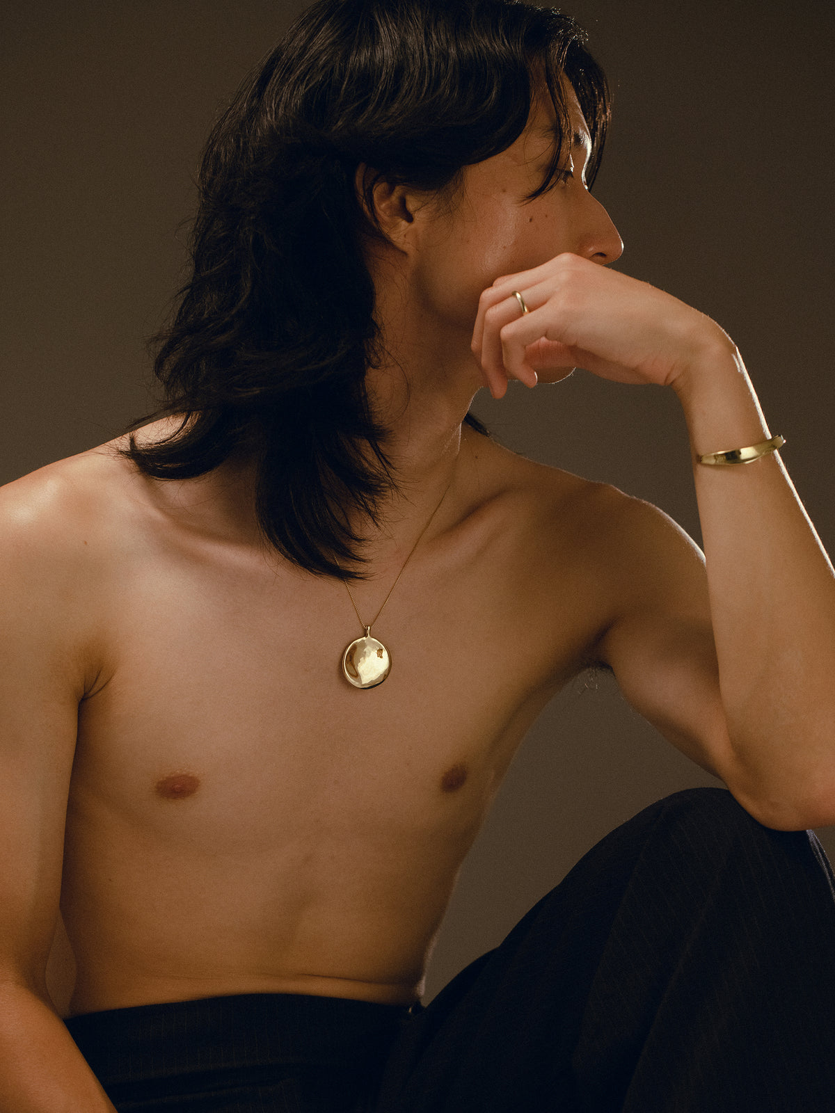 MOON necklace, RIVER ring, and RIVER cuff in gold plated bronze on model