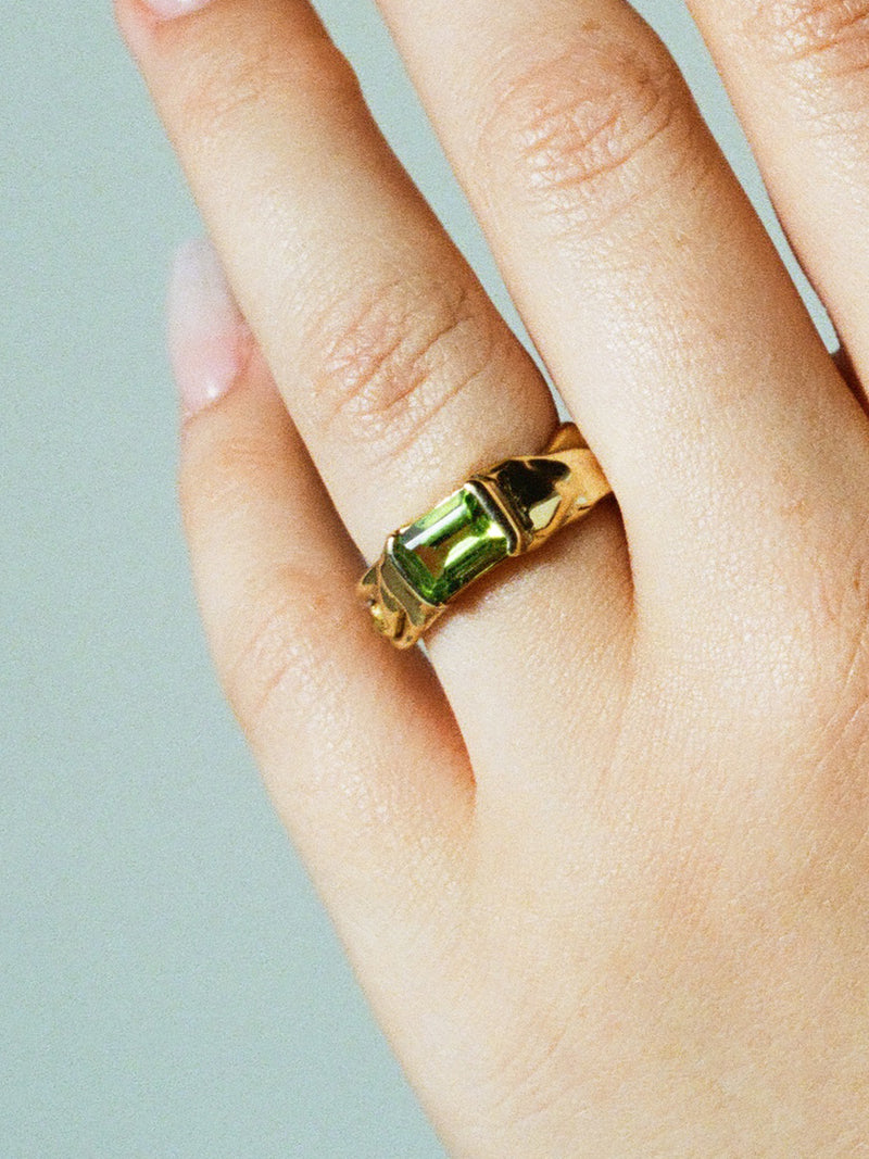 14k gold plate NAST ring with peridot on model