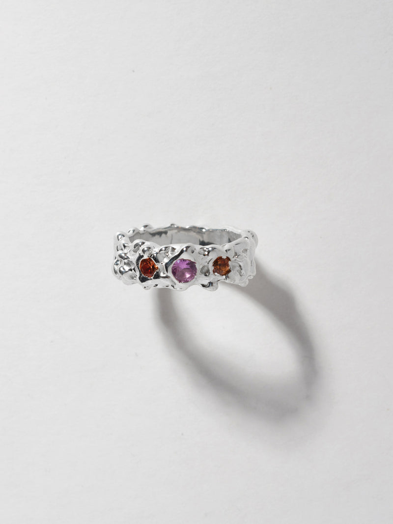 Close up product image of FARIS ROCA GEM Band in sterling silver with lab-created pink sapphire and lab-created orange sapphires. Front facing image