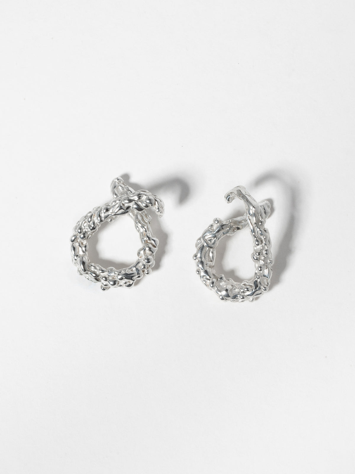 Product image of both left and right ear orientations of FARIS ROCA Hang in sterling silver.