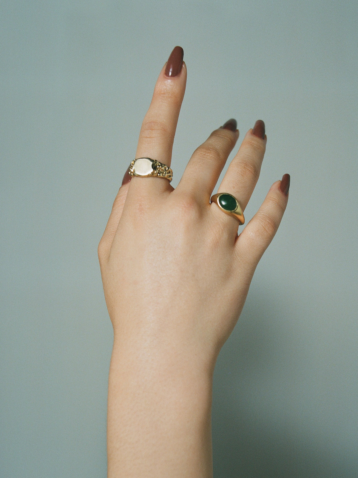 FARIS EYE Ring in 14k gold plate and jade cabochon styled with FARIS ROCA Signet Small in gold plate on female model