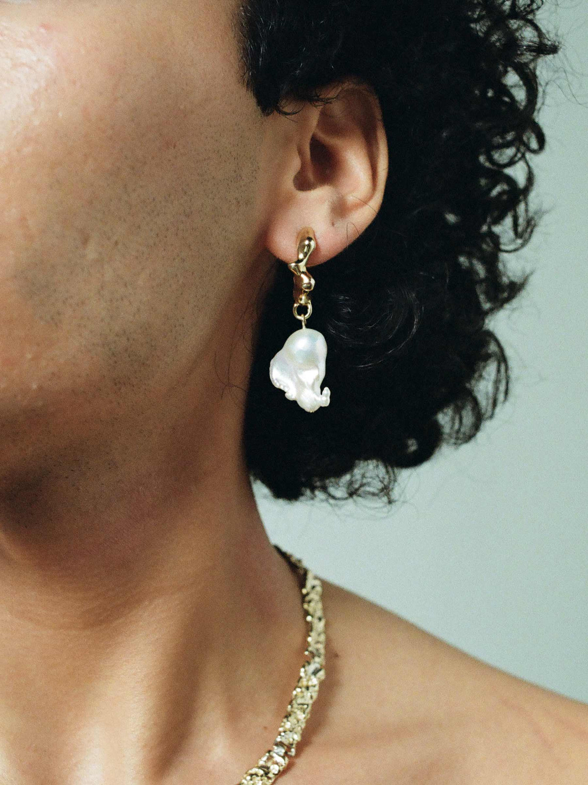 Close up image of FARIS SEEP BAROQUE Drops in 14k Gold Plate shown on model, styled with BRUTO Collar in 14k Gold Plate