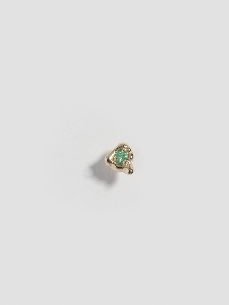 Top view of FARIS TASH Stud in 14k Gold embedded with an emerald stone