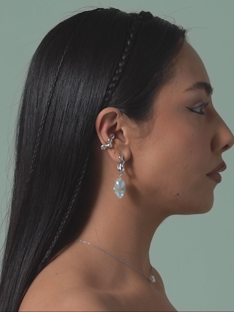 Short video of FARIS SEEP BAROQUE Drops in sterling silver shown on models profile. Styled with SEEP Ear Cuff in sterling silver and KESHI Necklace in sterling silver