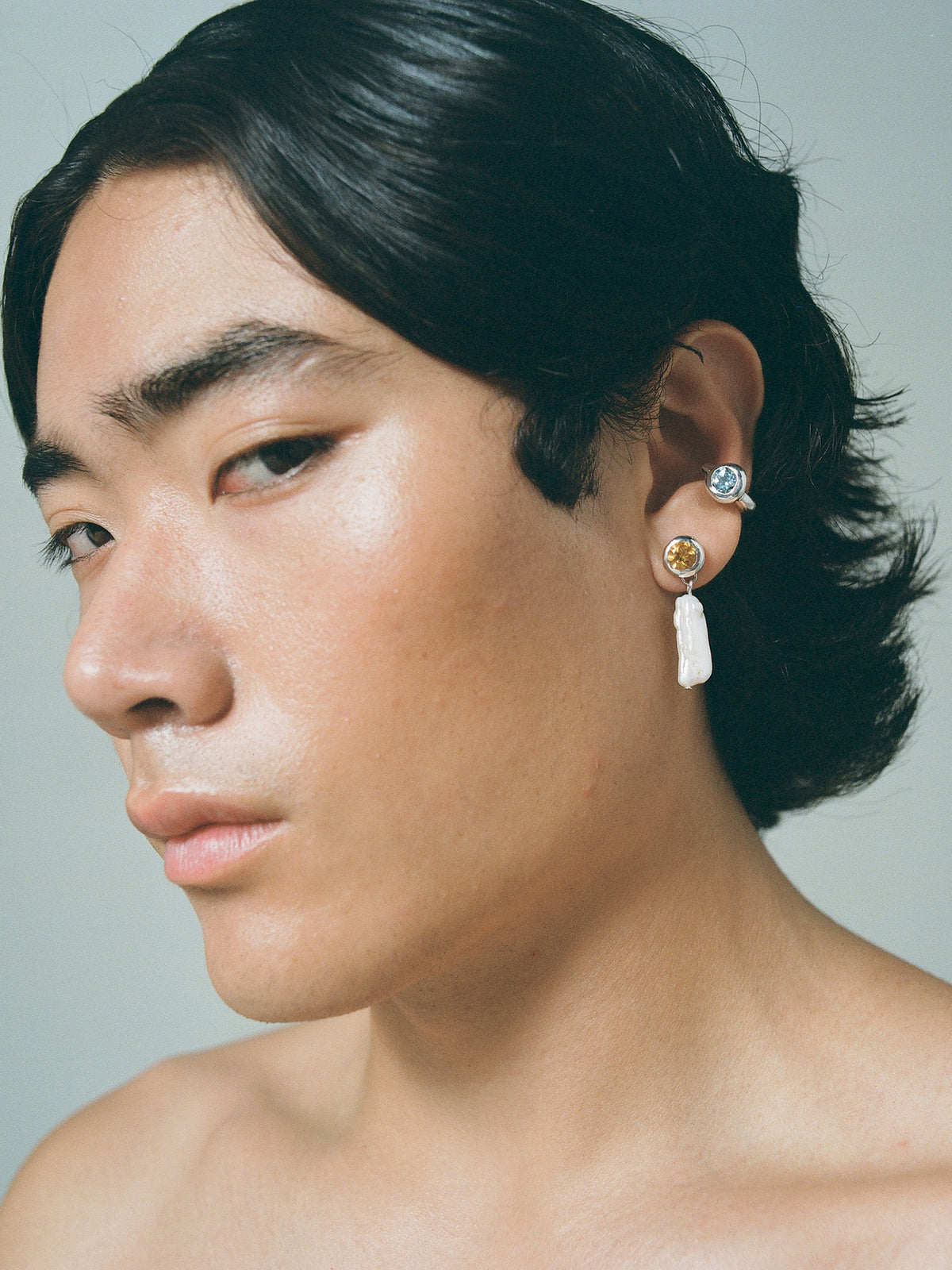 FARIS OH Ear Cuff in sterling silver and topaz shown on male model, styled with OH Drops in sterling silver with citrine